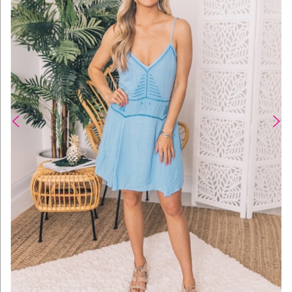 Above knee summer dress with lace eyelet cutouts.